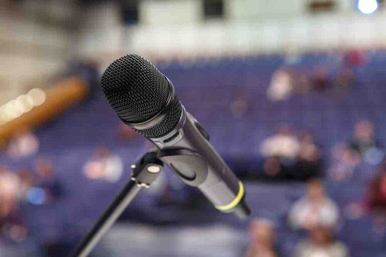 Microphone with blurred auditorium background