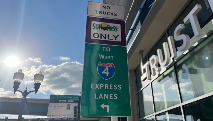I 4 Express Lanes sign No Trucks Sun Pass Only