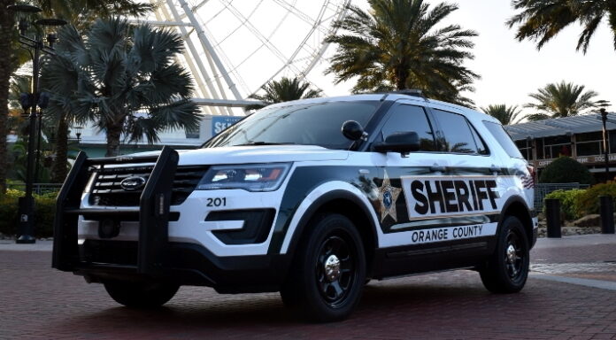Orange County Sheriffs Office vehicle in front of ferris wheel