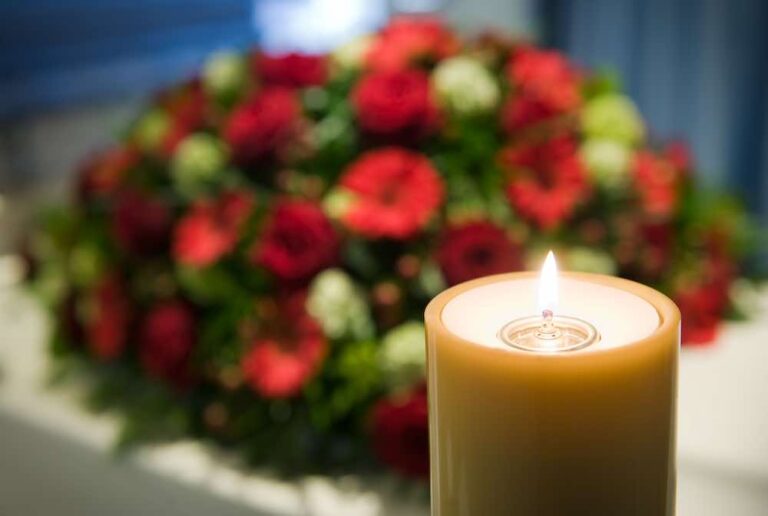 Obituary Obituaries Funeral red flowers and candle