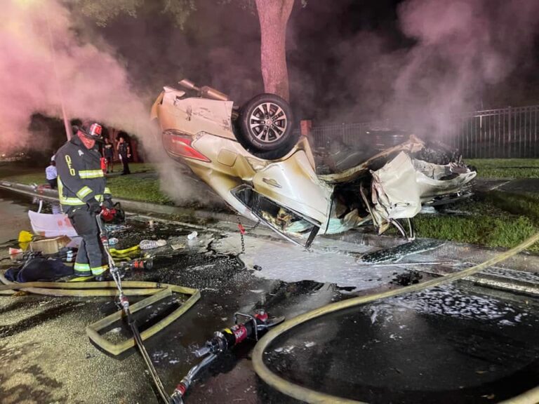Orlando Fire Department firefighters free woman trapped in overturned burning vehicle on Narcoossee Road