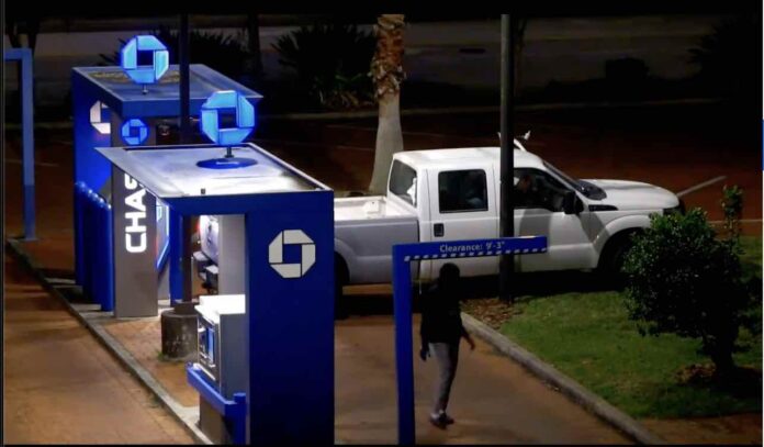 Pickup pulling cover off ATM at Chase Bank on East Colonial Drive in Orlando
