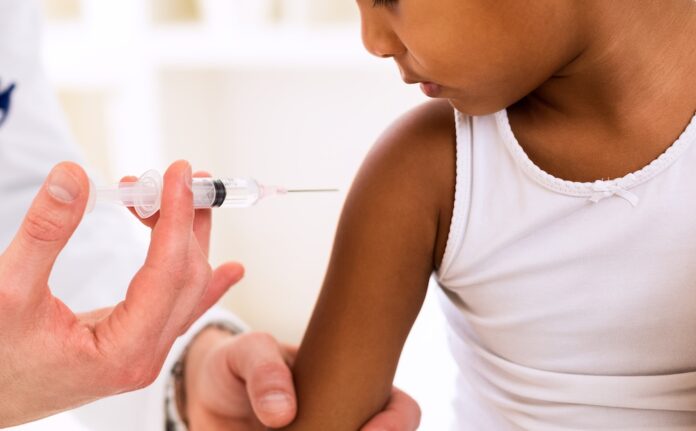 Girl receiving vaccine shot