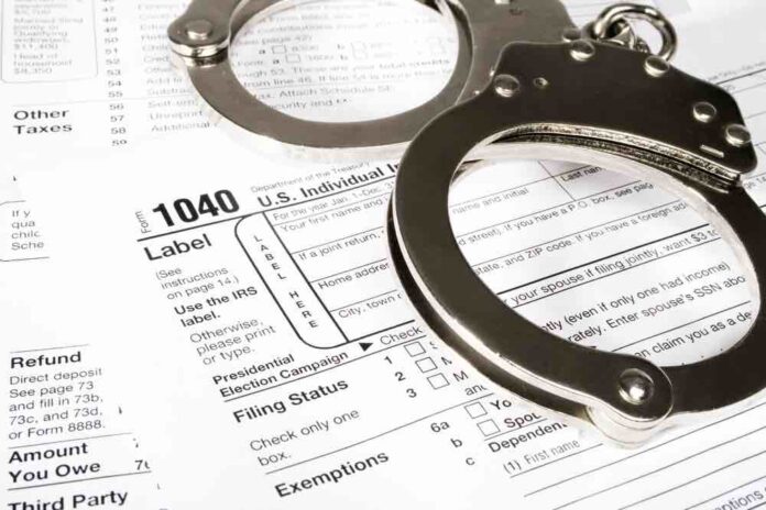 Handcuffs over IRS form 1040 Individual Tax Return