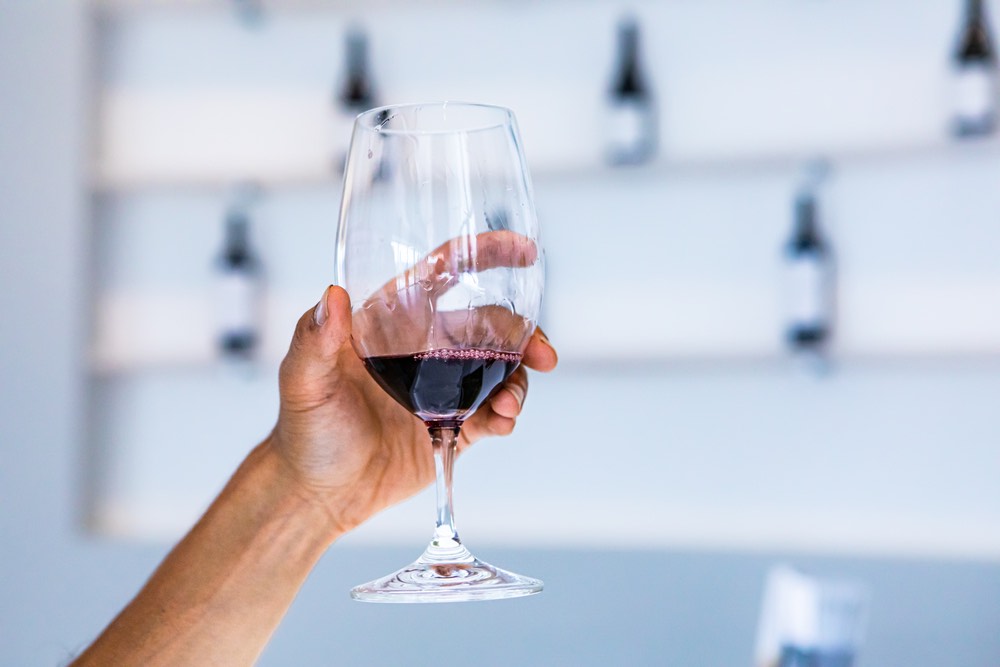 Man hand holding wine glass