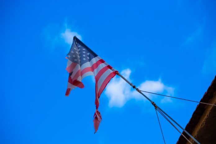 Torn American Flag on flagpole