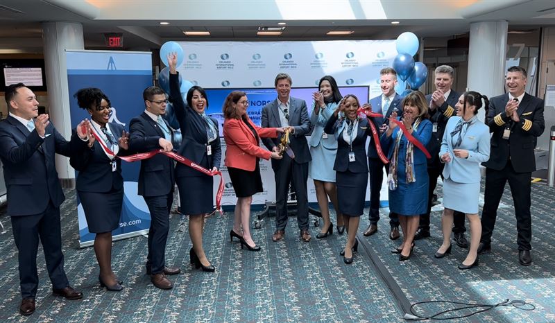 Norse Atlantic Airlines officials celebrate a ribbon cutting for new services at the Orlando International Airport