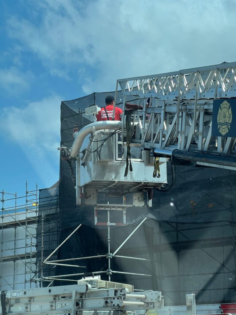 Orlando Fire Department extracating man trapped in building after falling from scaffolding