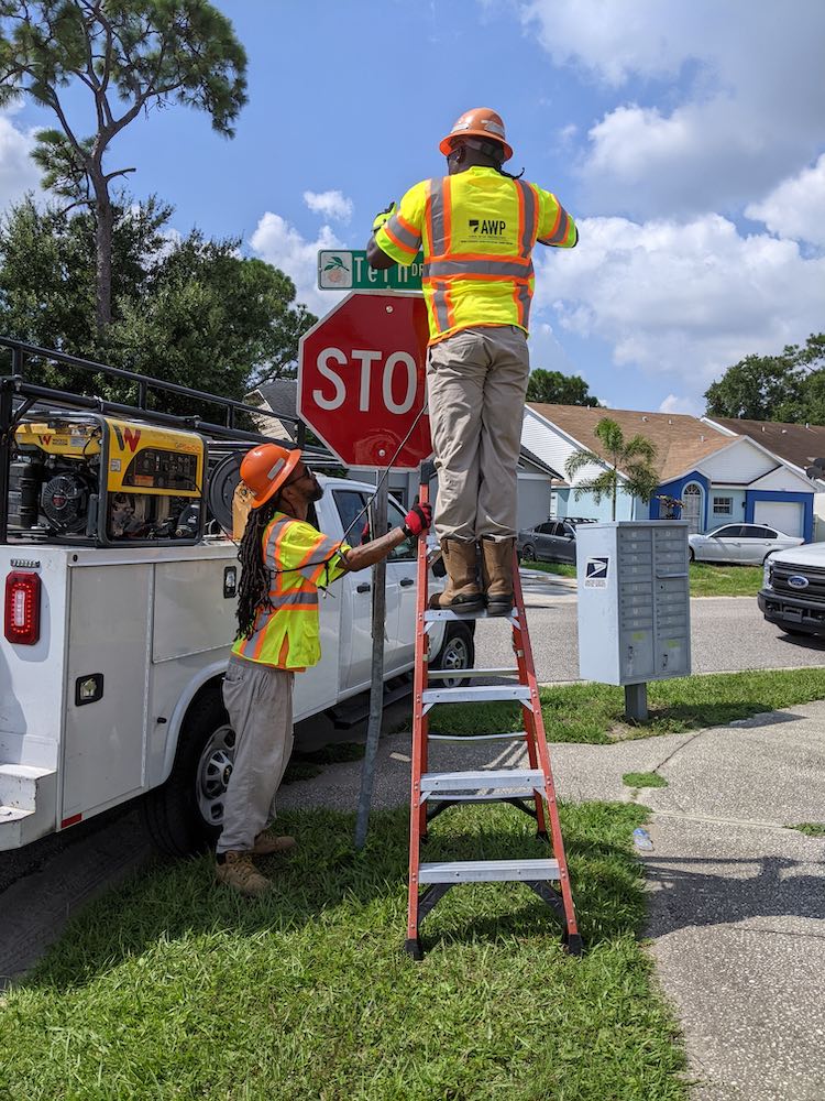 Orange County public works crews work to replace yield signs with stop signs