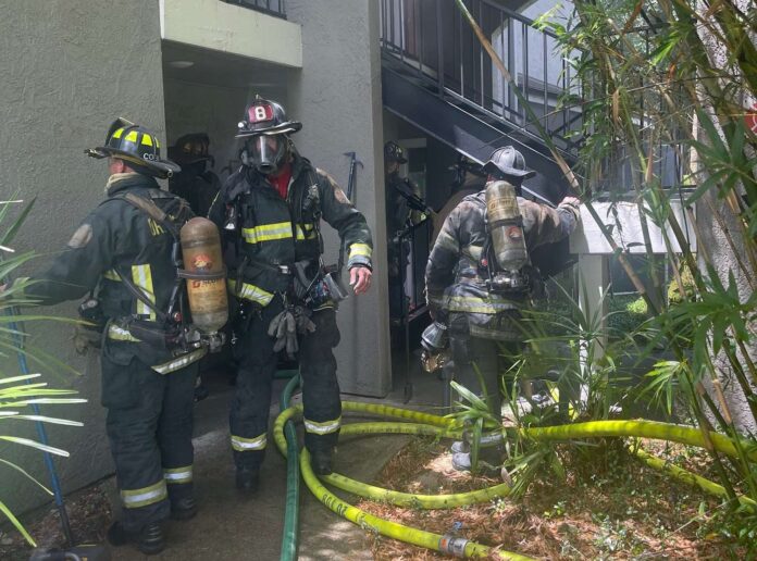 Orlando Fire Department crews extinguish fire in hidden wall at apartment complex
