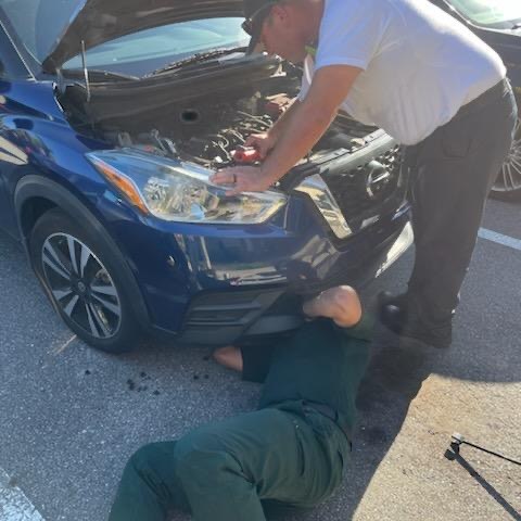Seminole County officials work to free a cat trapped in a car