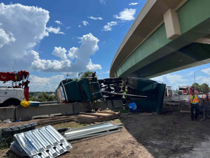 Semi truck containing lumber overturns near Floridas Turnpike South and I-4