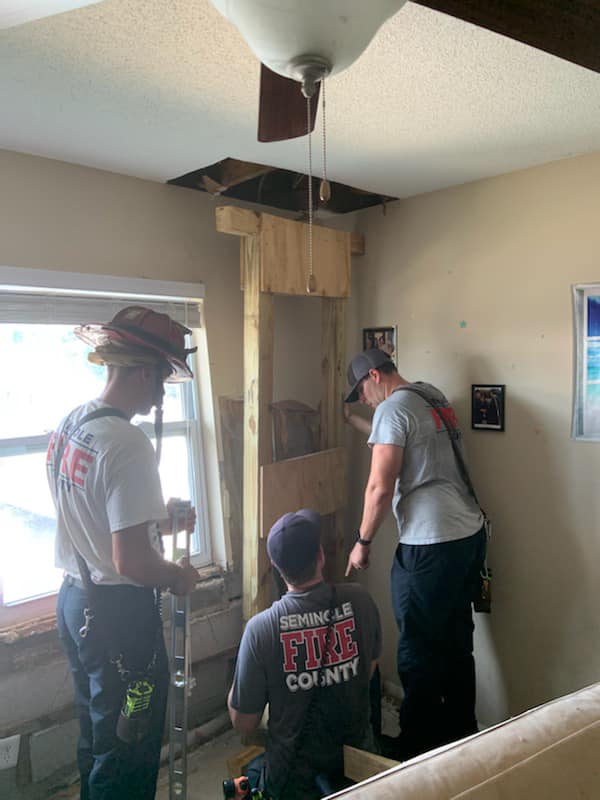 Seminole County Fire Department crews shore up an apartment building after it was struck by a vehicle in Winter Park on Sunday