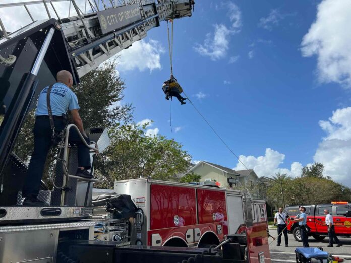 Orlando Fire Department crews lift injured resident from apartment using ladder