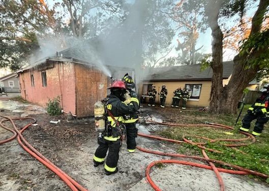 Orlando Fire Department crews work to extinguish a fire at a home in Parramore