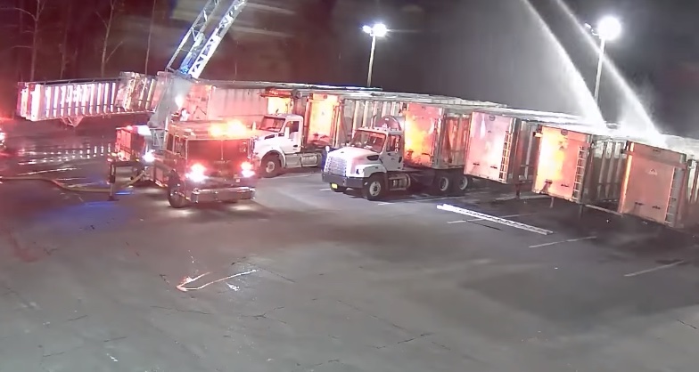 Seminole County Fire Department crews water down trailers after lithium ion battery fire