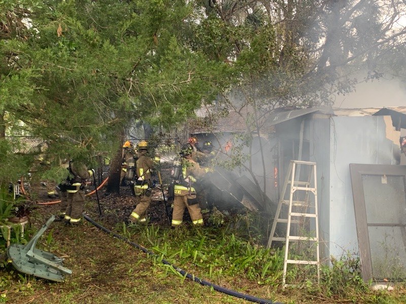Seminole County Firefighters work to subdue a shed fire on February 12