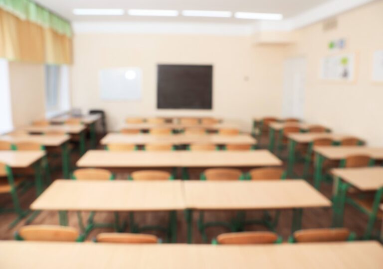 Blurred view of empty modern classroom at school