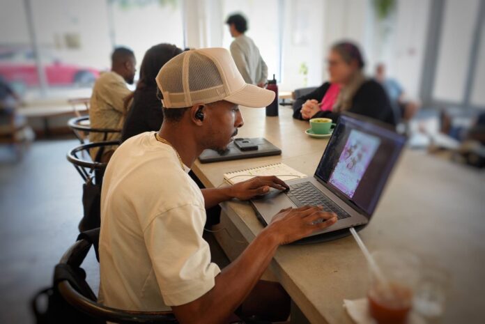 Donell Butler III working remotely from Deeply cafe in downtown Orlando (May 18, 2023)