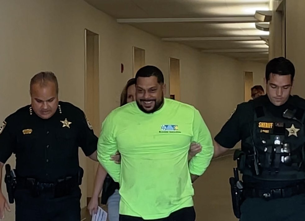Jorge Aponte Gonzalez smiling during his arrest