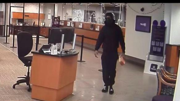 Masked suspect wanted in armed robbery at Truist Bank on May 17