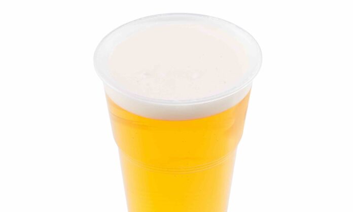 Plastic cup of beer, ale, lager with head