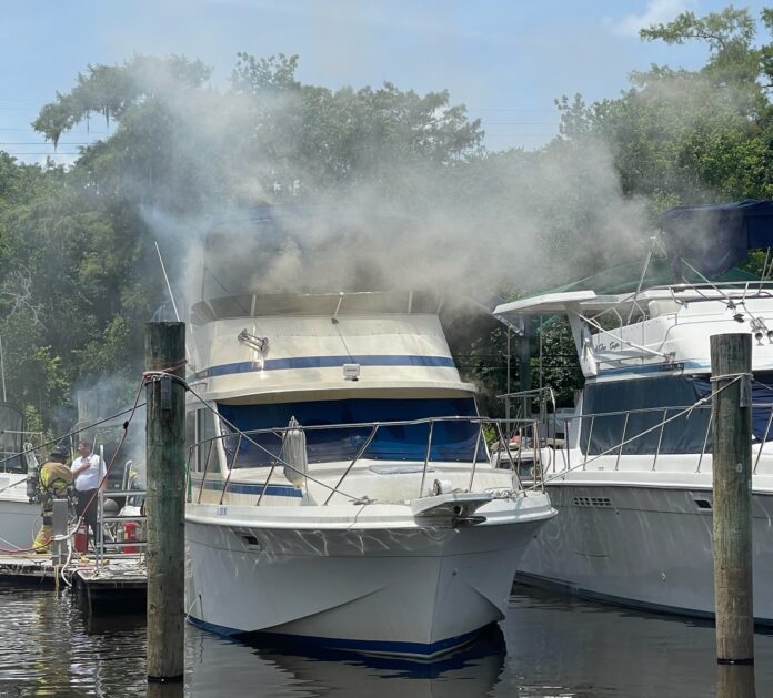 Smoke eminating from boat at Boat Tree Marina in Sanford on May 11