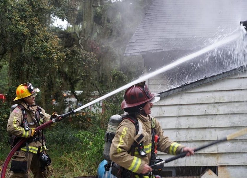 Firefighters work to subdue fire at abandoned residence in Sanford on June 22 Norman Reyburn