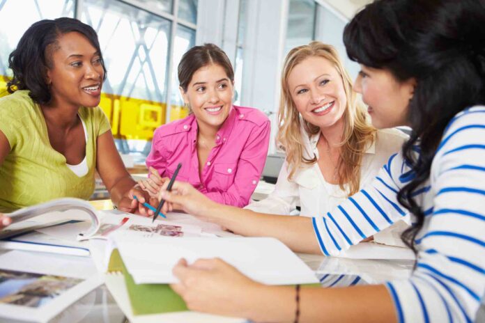 Professional women sitting around table for business