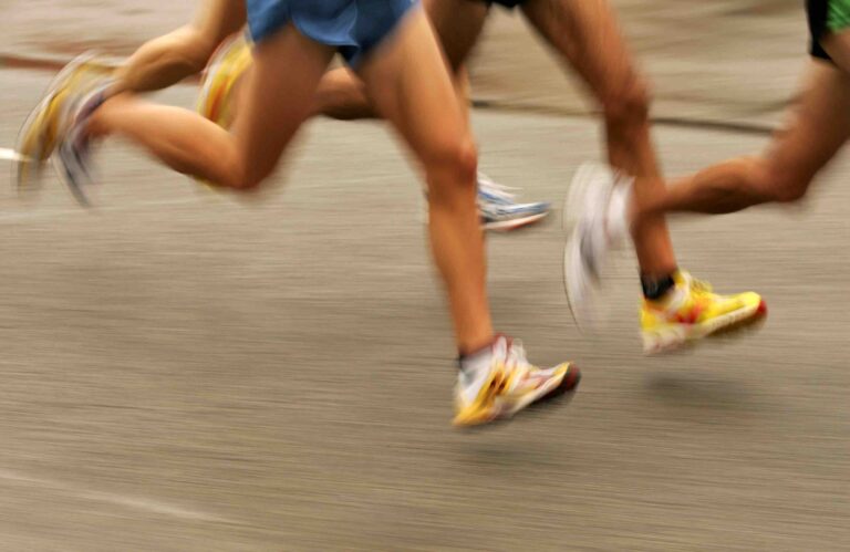 Feet of runners running a 5K race