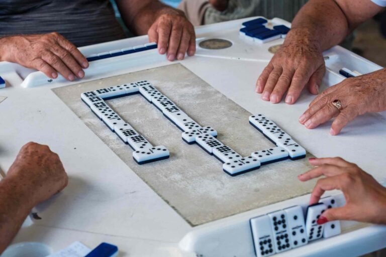 Hispanic and Latin American individuals playing dominoes