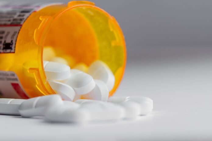 Hydrocodone pills in prescription medication container