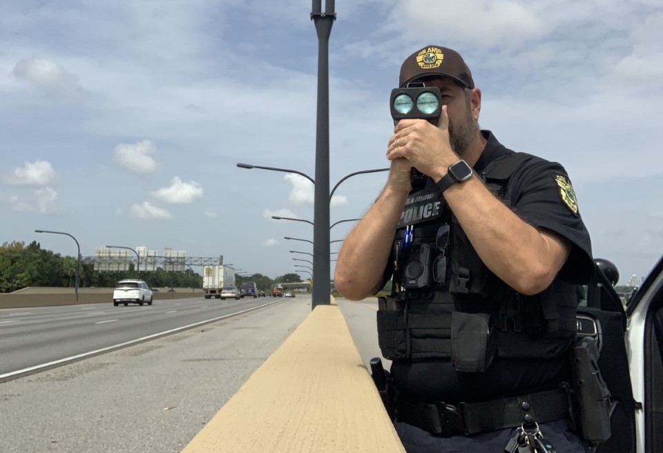 OPD officer using speed radar on Interstate 4