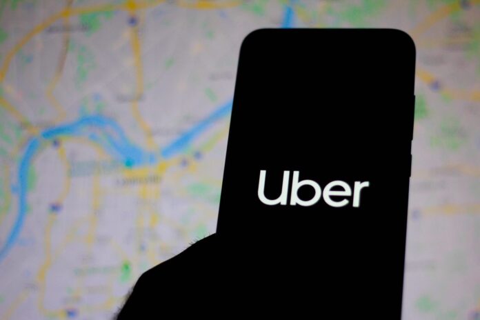 December 11, 2019. In this photo illustration the Uber logo is seen displayed on a smartphone