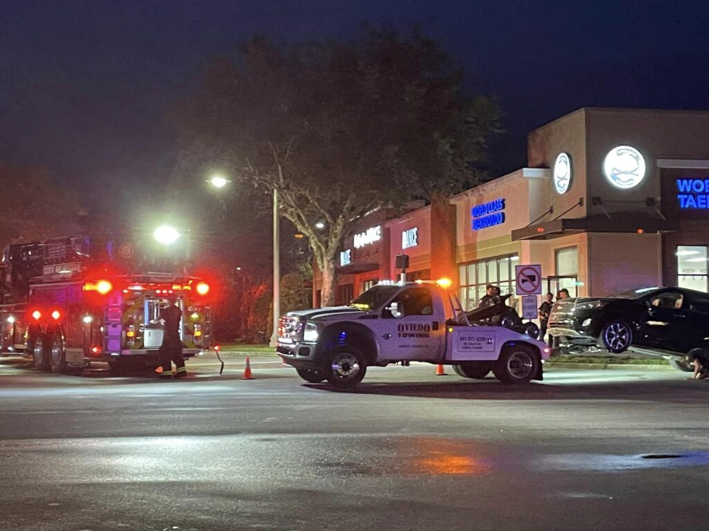 A tow truck removes the SUV that crashed into Major Roberts World Class Taekwondo on August 29