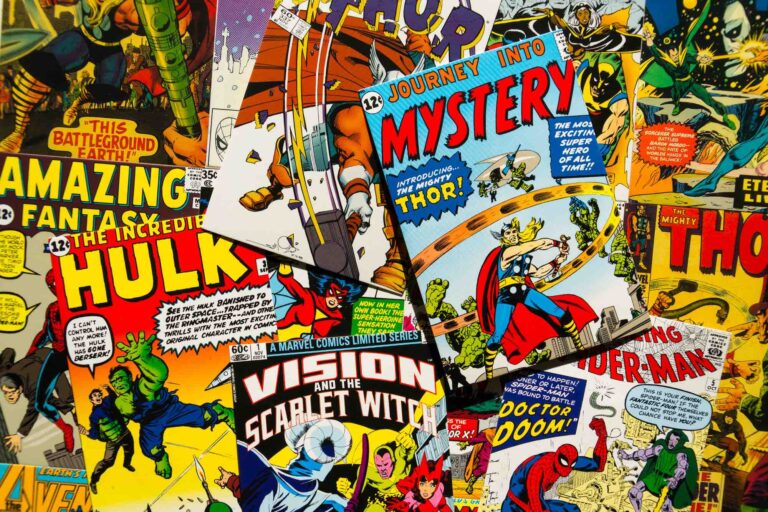 Comic book covers with Hulk, Spiderman, Thor, and other heroes