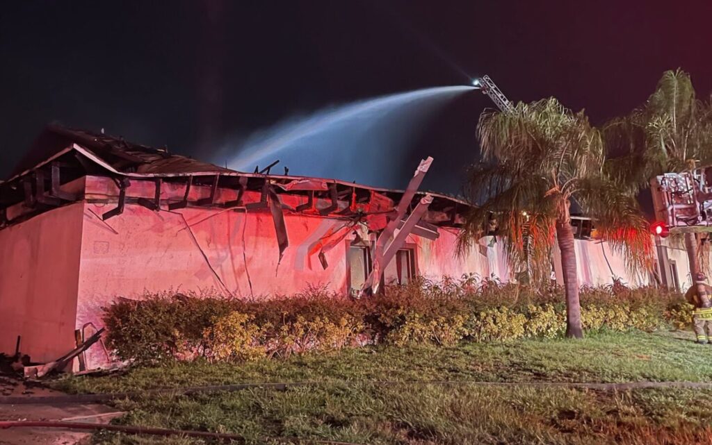 Water being sprayed on church destroyed by fire in Orlando on August 22