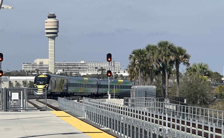 Brightline train pulling into Orlando International Airport