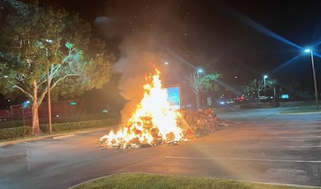 Garbage truck contents on fire