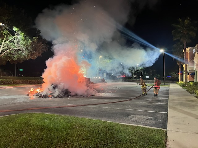 OCFR extinguishing fire from garbage truck