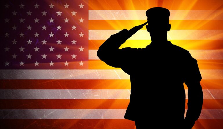 Proud saluting male army soldier on american flag background