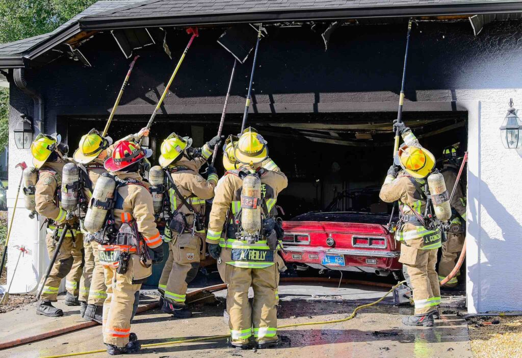 Firefighters work to extinguish garage fire in Orange County on December 23
