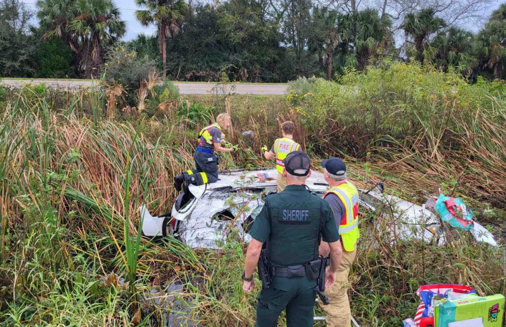 First responders retrieving gifts from submerged vehicle
