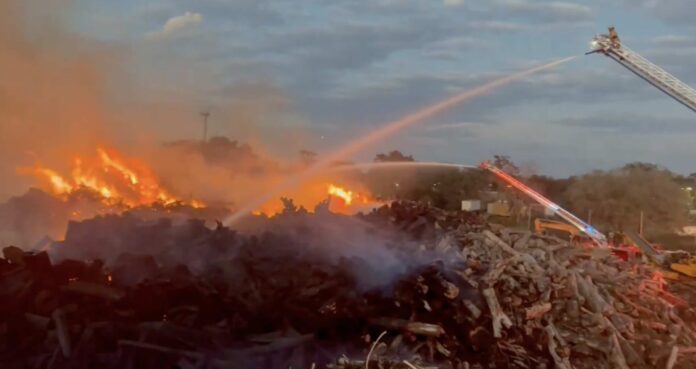 Fire rages at lumber yard in Orlando