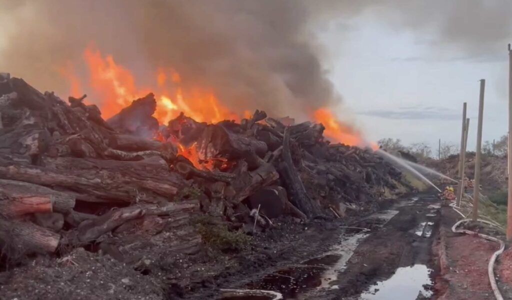 Firefighters working on fire at lumber yard in Orlando
