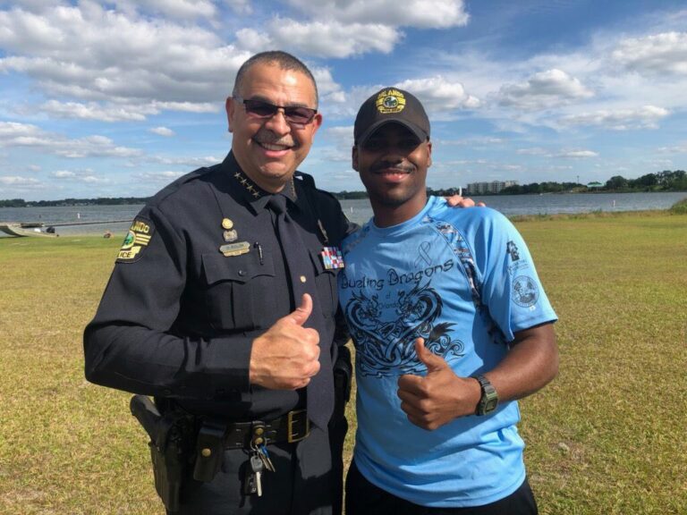 Officer Darius Barker with Chief Rolón at Operation Positive Direction Dueling Dragons practice
