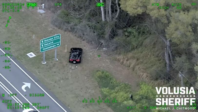 Armed carjacking suspects stopping vehicle on side of road on March 5, 2024