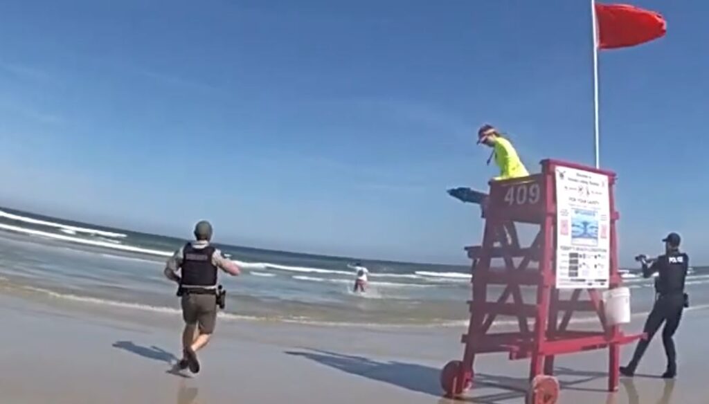 Armed suspect running into water on New Smyrna Beach (Photo by Volusia County Sheriff's Office)