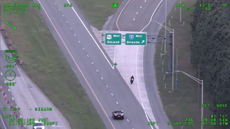 Teen motorcyclist with WILL RUN license plate fleeing from deputy motorcycle heading onto I 4