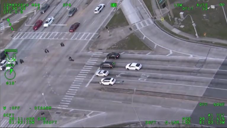 Teen motorcyclist with WILL RUN license plate fleeing from deputy teen running red light (aerial photo)